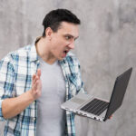 astonished-guy-with-laptop-opened-mouth-scaled